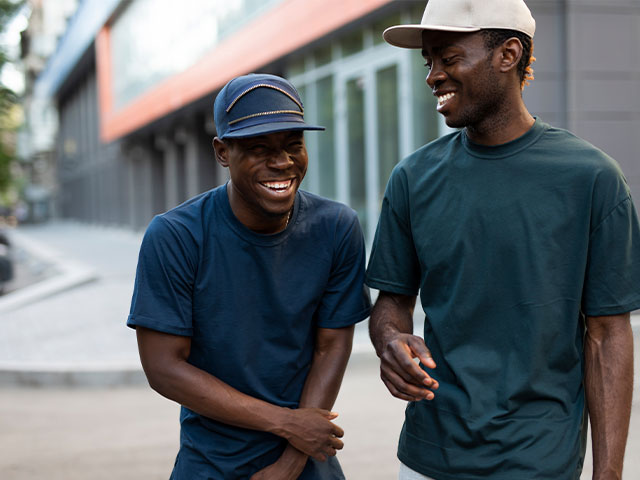 Two friends walking on campus