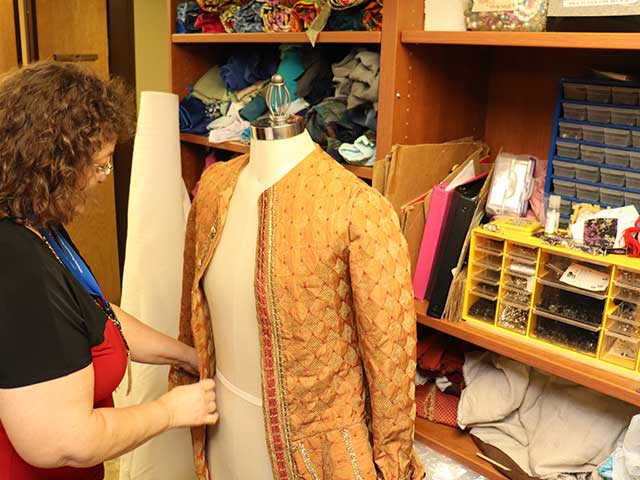 Theatre Faculty working on costume