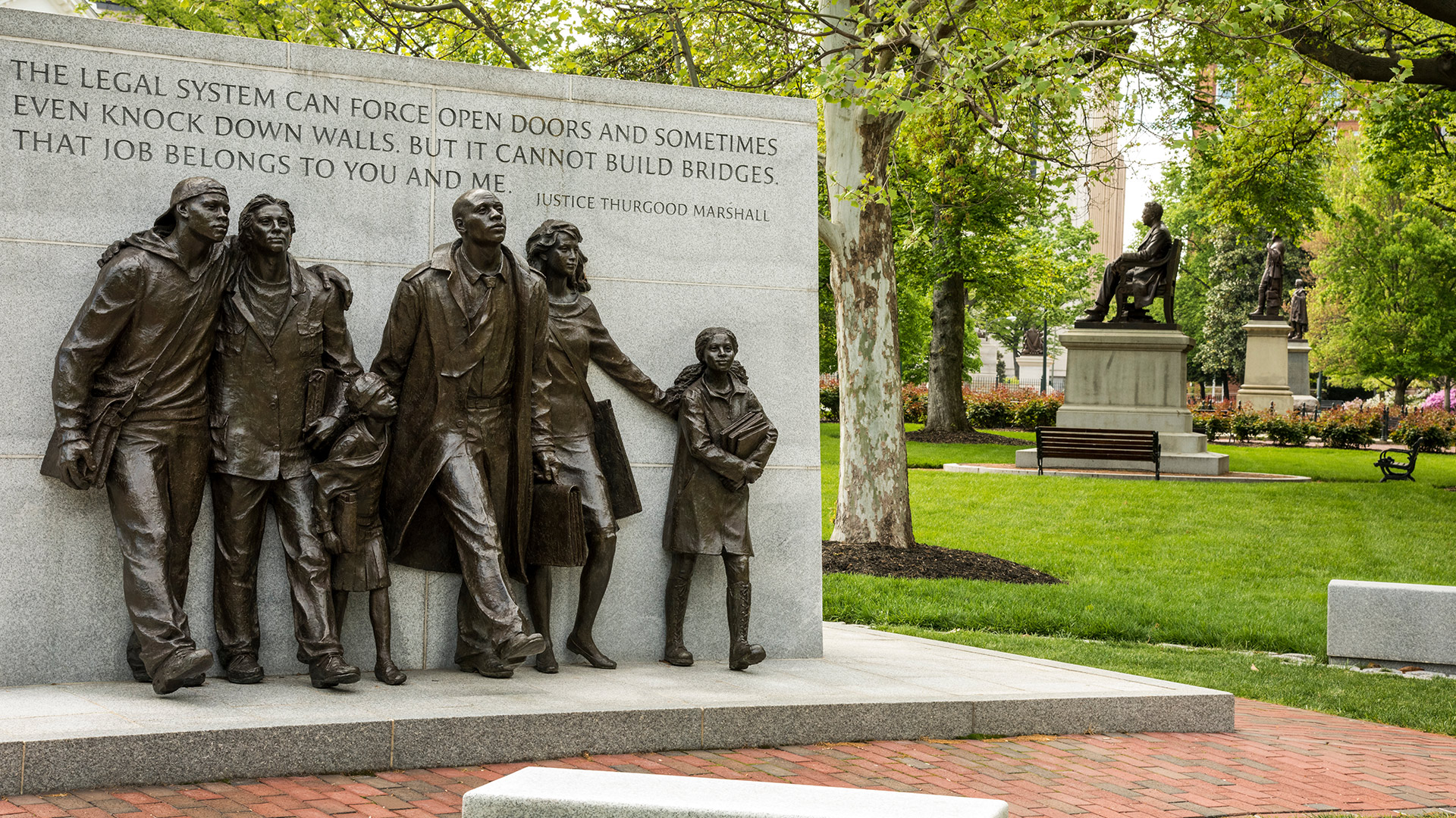 Historic Capitol Square Richmond Virginia Civil Rights Monument with quote from Thurgood Marshall (first African American U.S. Supreme Court justice). It reads: "The legal system can force open doors, and sometimes-even knock down walls, but it cannot build bridges. That job belongs to you and me."