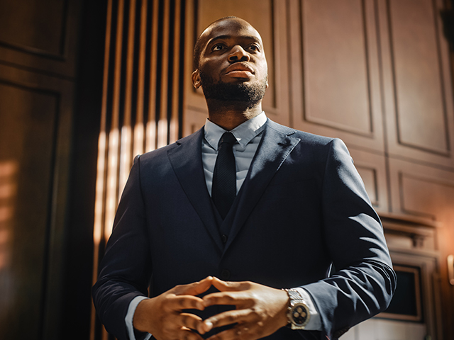 Charismatic African american Male lawyer in courtroom