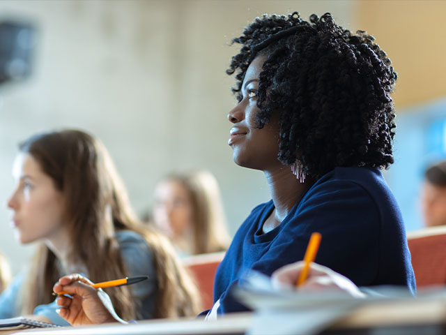 Student listening to lecture in philosophy class