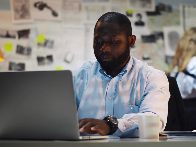 Public defender working on laptop